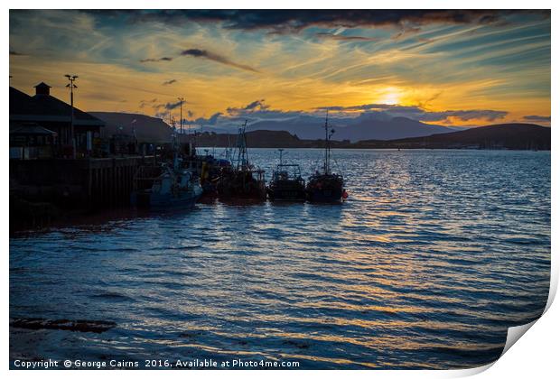 The sun sets on Oban harbour and fishing boats Print by George Cairns