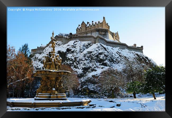 Edinburgh Castle and Ross Fountain in snow Framed Print by Angus McComiskey
