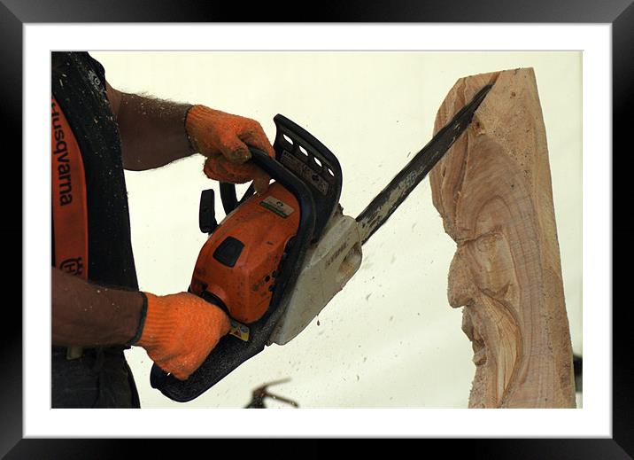Wood carving with a chainsaw Framed Mounted Print by Chris Day