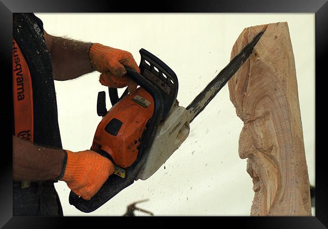Wood carving with a chainsaw Framed Print by Chris Day