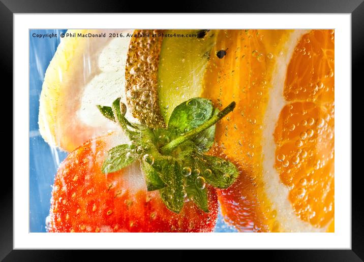 A strawberry, orange, kiwi and lemon cocktail Framed Mounted Print by Phil MacDonald