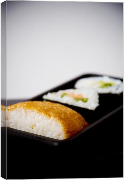 Sushi tray, salad rolls, inari pockets Canvas Print by K. Appleseed.