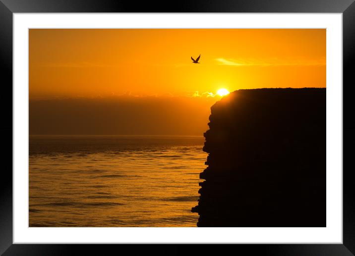 Nash point sunset silhouette Framed Mounted Print by Dean Merry