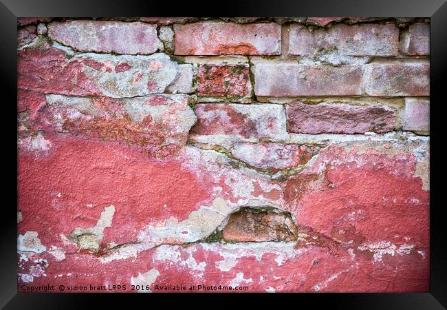 Grunge red wall with broken plaster close up Framed Print by Simon Bratt LRPS