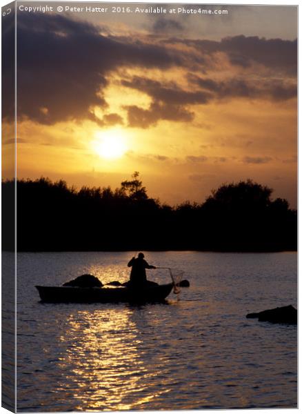 Fishing in a boat at sunset. Canvas Print by Peter Hatter