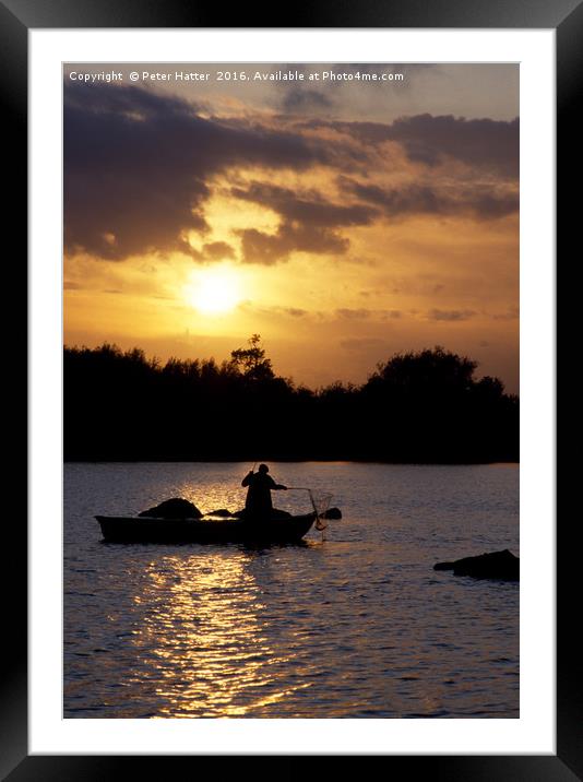 Fishing in a boat at sunset. Framed Mounted Print by Peter Hatter