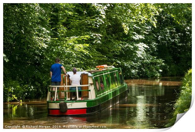 Couple steering a canal boat down the Brecon Canal Print by Richard Morgan