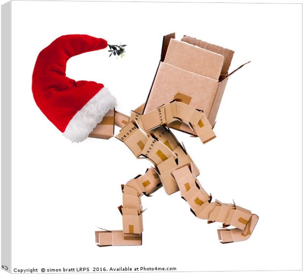 Christmas character carrying a large box  Canvas Print by Simon Bratt LRPS