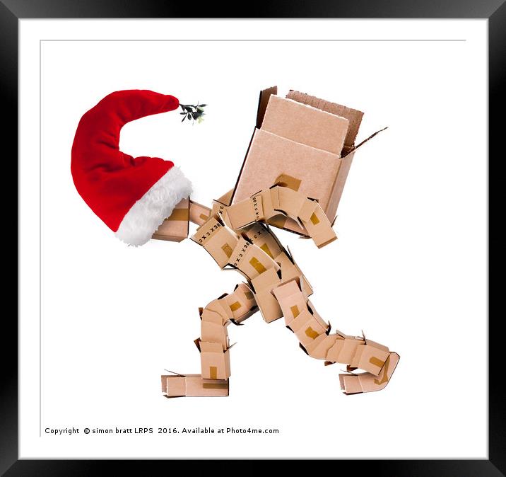 Christmas character carrying a large box  Framed Mounted Print by Simon Bratt LRPS