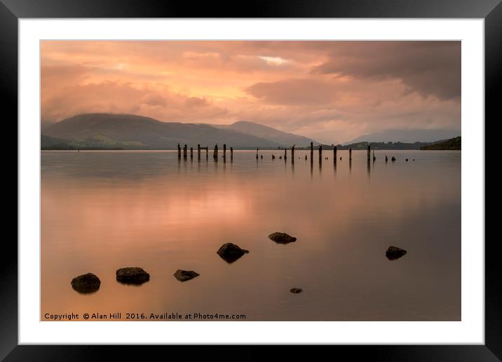 Loch Lomond jetty and mountains at sunset Framed Mounted Print by Alan Hill