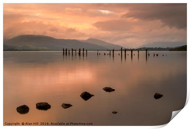 Loch Lomond jetty and mountains at sunset Print by Alan Hill