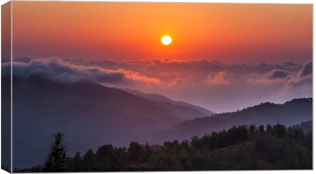 Sunset above clouds at altitude in Troodos Montain Canvas Print by Alan Hill
