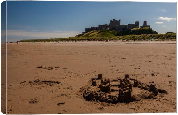 Bamburgh Castle beach Canvas Print by Thomas Schaeffer