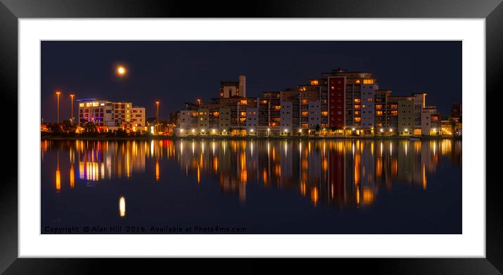 The moon and cityscape lights, reflect off harbour Framed Mounted Print by Alan Hill