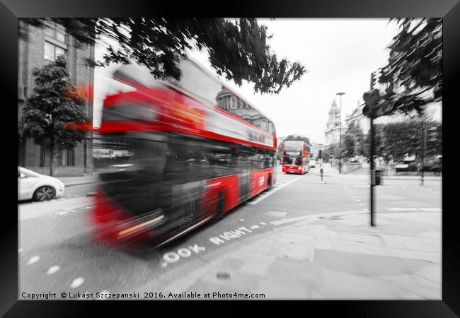 Red double-decker bus on the street of London Framed Print by Łukasz Szczepański