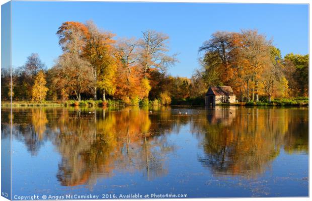 Boathouse on Penicuik Pond in autumn Canvas Print by Angus McComiskey
