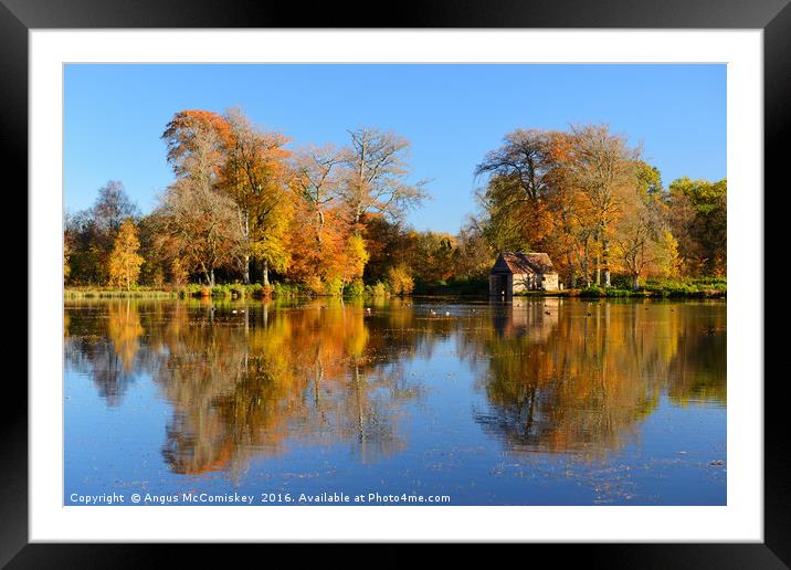 Boathouse on Penicuik Pond in autumn Framed Mounted Print by Angus McComiskey