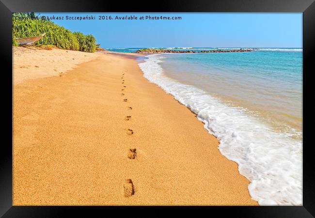 Footprints on a sandy beach by blue Indian Ocean Framed Print by Łukasz Szczepański