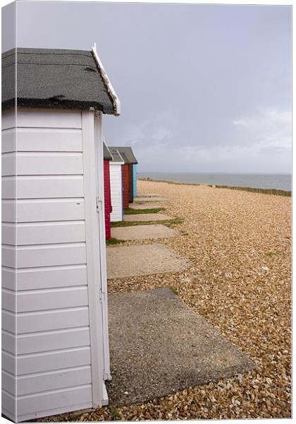 Colourful beach huts in Calshot Canvas Print by Ian Middleton