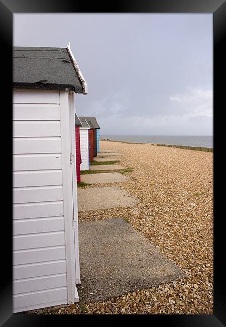 Colourful beach huts in Calshot Framed Print by Ian Middleton