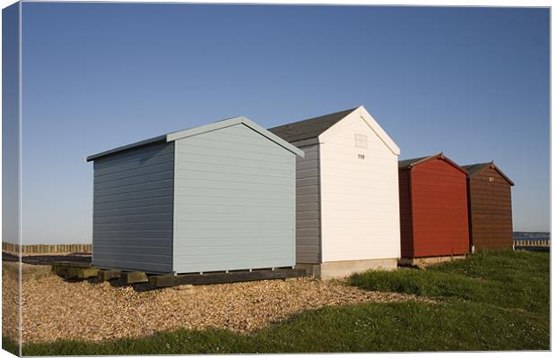 Colourful beach huts in Calshot Canvas Print by Ian Middleton