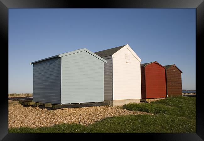 Colourful beach huts in Calshot Framed Print by Ian Middleton