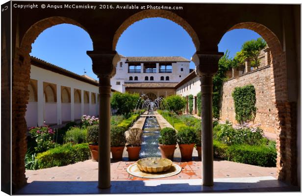 Fountain and water channel in Generalife Palace Canvas Print by Angus McComiskey