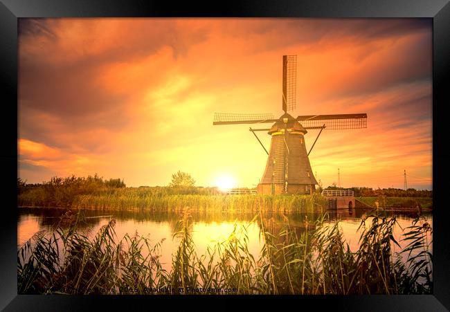 Sunrise on the Kinderdijk windmill, the UNESCO wor Framed Print by Ankor Light