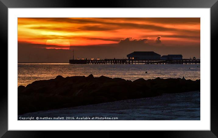 Last Moments of Sun Behind Clacton Pier Framed Mounted Print by matthew  mallett
