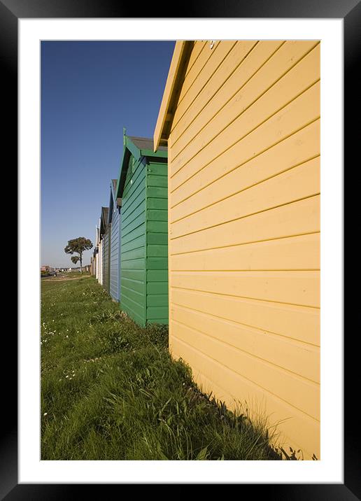 Colourful beach huts in Calshot , Solent , Hampshi Framed Mounted Print by Ian Middleton