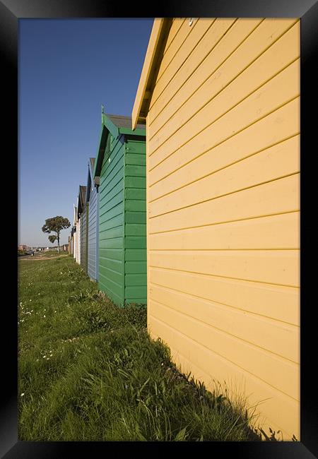 Colourful beach huts in Calshot , Solent , Hampshi Framed Print by Ian Middleton
