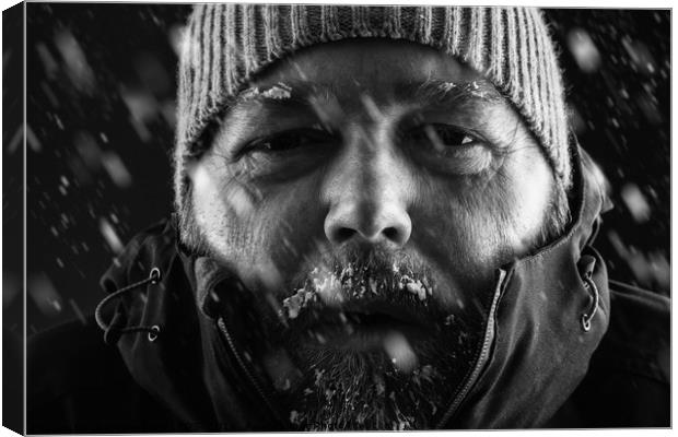 Man freezing in snow storm close up Canvas Print by Simon Bratt LRPS