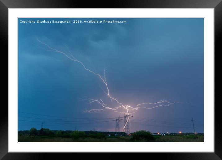 Lightning strikes electricity pylon Framed Mounted Print by Łukasz Szczepański