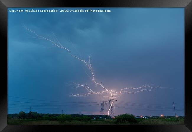 Lightning strikes electricity pylon Framed Print by Łukasz Szczepański