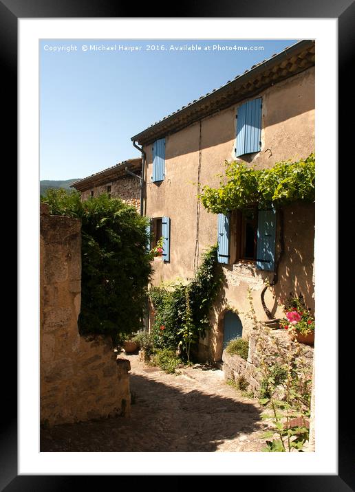 Medieval stone building with wooden shutters in ru Framed Mounted Print by Michael Harper