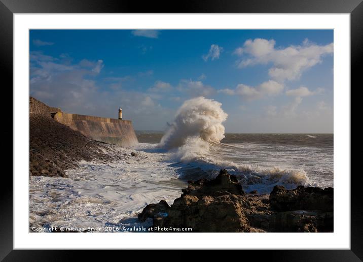 Large wave crashing into the pier at Porthcawl Framed Mounted Print by michael Bryan