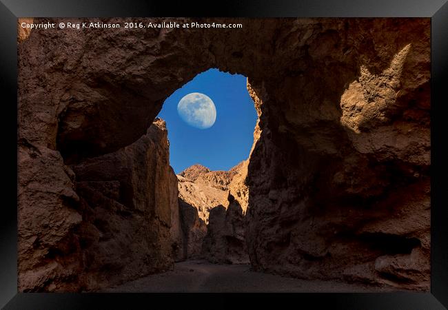 Moon Through Rock Arch Framed Print by Reg K Atkinson