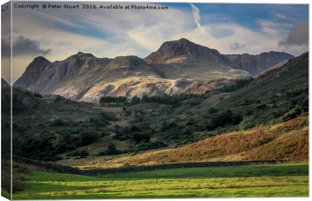 The Langdale Pikes Canvas Print by Peter Stuart