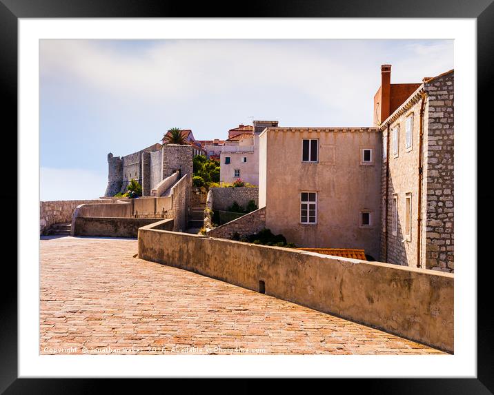 Dubrovnik Buildings on the city walls Framed Mounted Print by Jonathan Baker