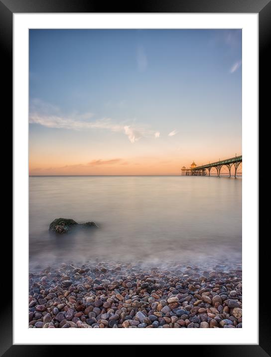 Pebbles and Pier Framed Mounted Print by Chris Sweet
