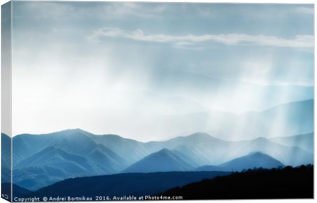 Hills with rainy ranges with sunlight Canvas Print by Andrei Bortnikau