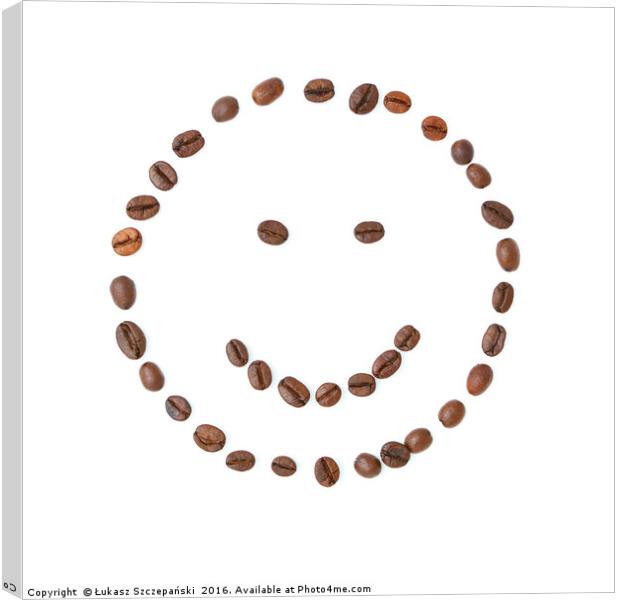 Smiling face emoticon made of coffee beans Canvas Print by Łukasz Szczepański
