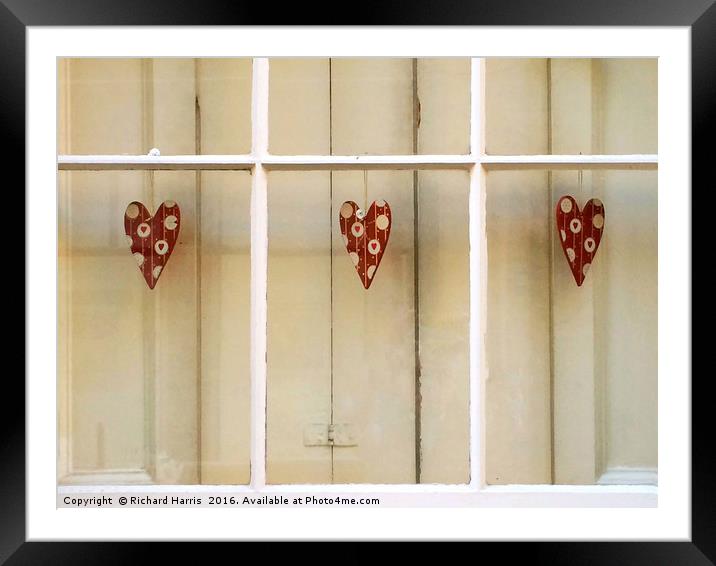 Decorative hearts displayed inside shuttered windo Framed Mounted Print by Richard Harris