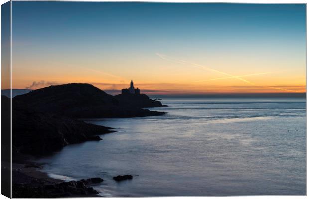 Mumbles lighthouse at sunrise.  Canvas Print by Bryn Morgan