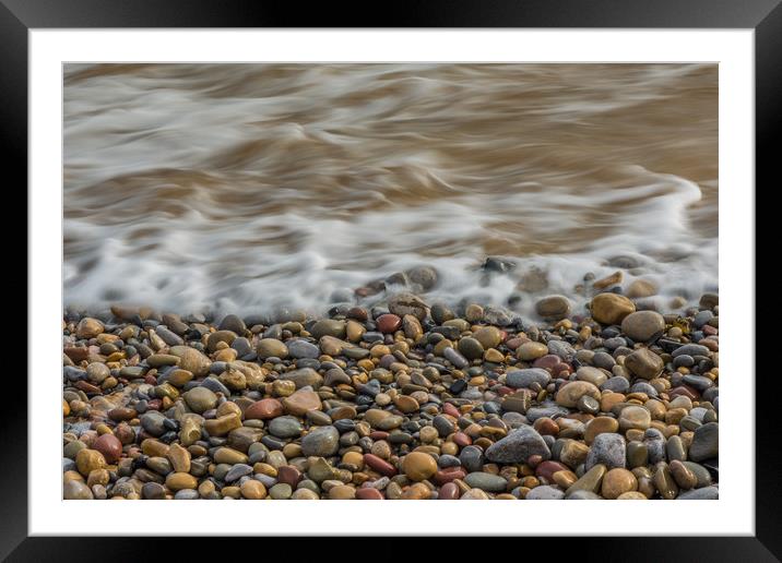 Pebbles on the beach. Framed Mounted Print by Bryn Morgan