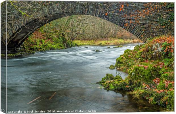 Footbridge over the River Brathay Lake District  Canvas Print by Nick Jenkins