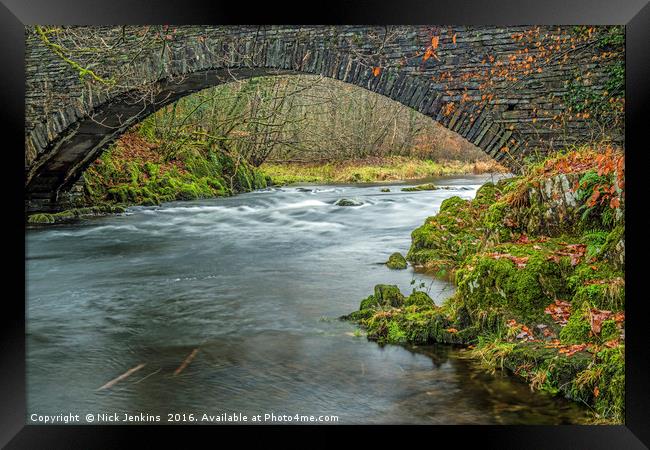 Footbridge over the River Brathay Lake District  Framed Print by Nick Jenkins