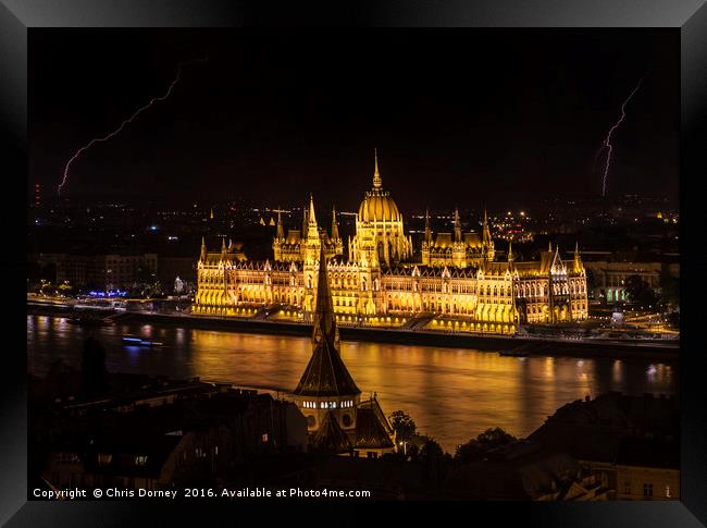 Hungarian Parliament Building and Lightning Framed Print by Chris Dorney