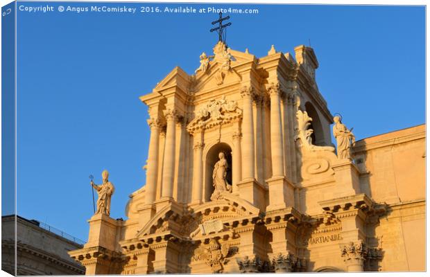 Sunset on facade of Syracuse Cathedral Canvas Print by Angus McComiskey