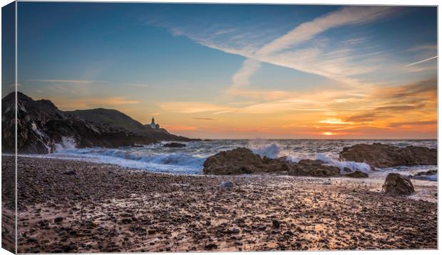 Sunrise at Mumbles lighthouse. Canvas Print by Bryn Morgan